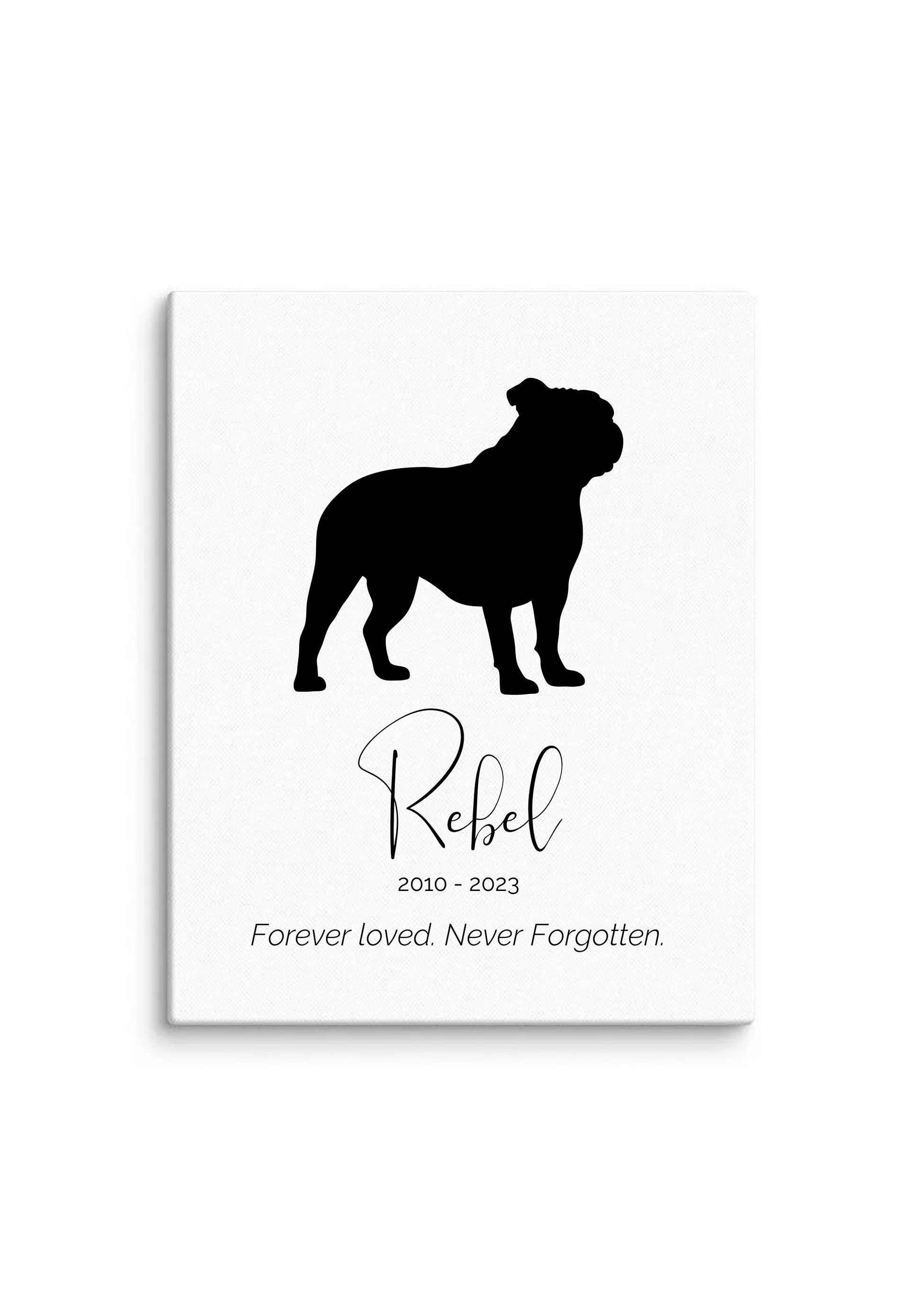White canvas pet memorial print featuring solid bulldog silhouette, pet name Rebel, and tribute message